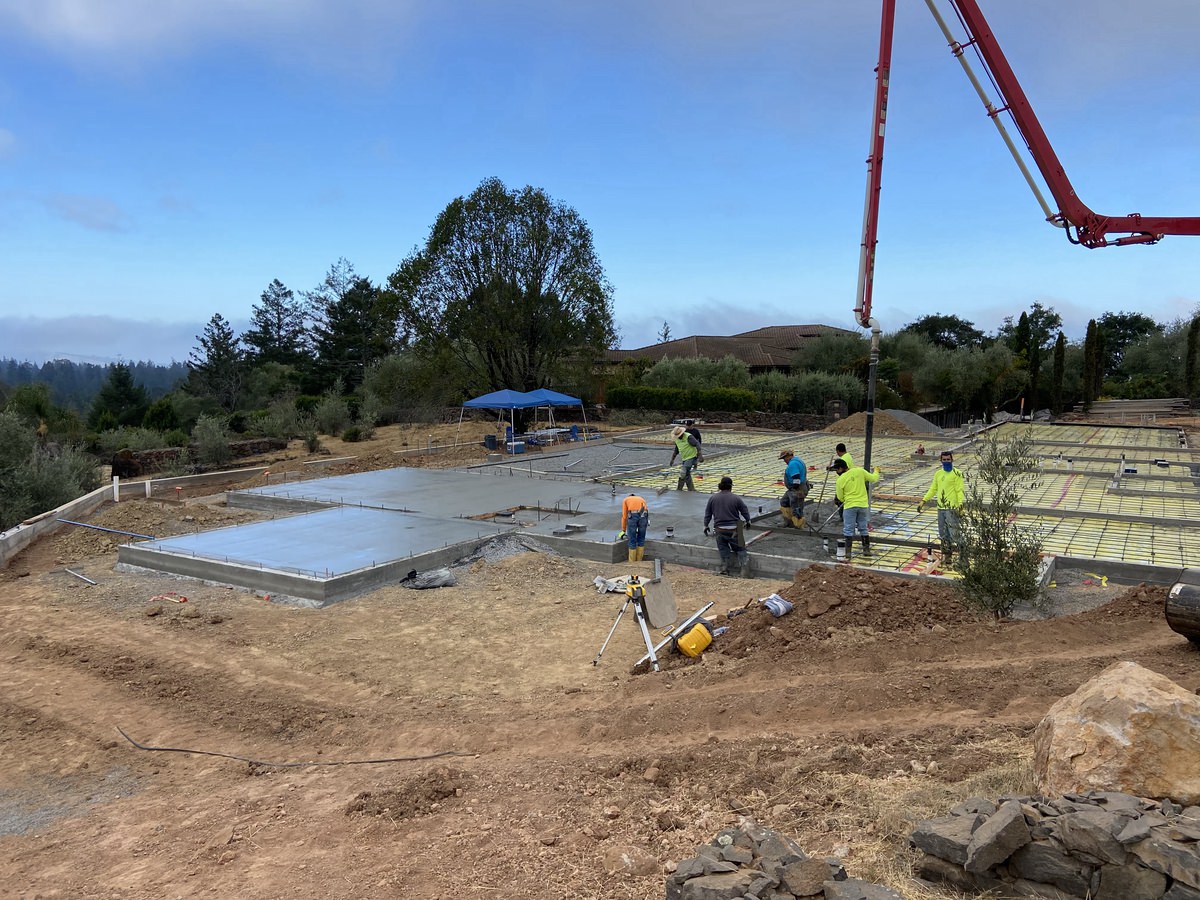concrete being poured in by truck 