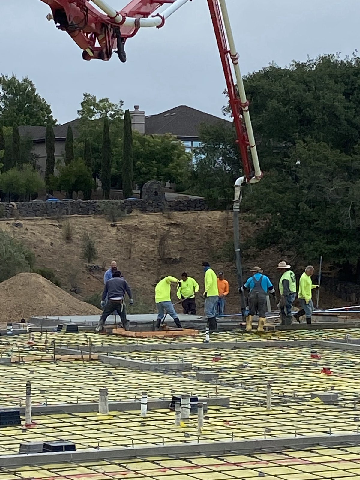 close up view of workers working with freshly poured concrete